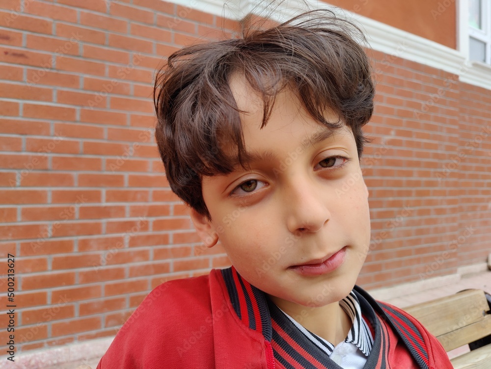 handsome male student making strange, weird and funny facial expressions. handsome male student making strange, weird and funny facial expressions.