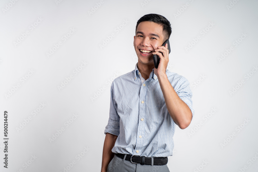 business worker laughing while talking on a phone on isolated background business worker laughing while talking on a phone on isolated background