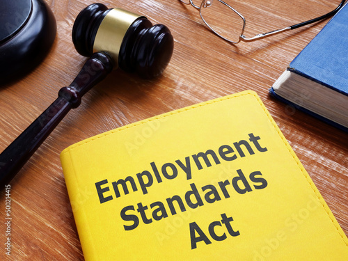 Employment standards act is shown using the text on a book