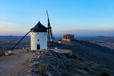 Group of old windmills in the city of Consuegra (Spain), on the route of the Don Quixote and Cervantes mills, at sunset