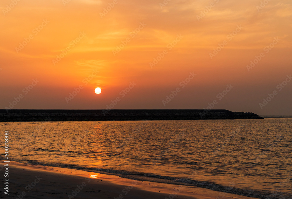 Shot of a dramatic sunset by the beach. Nature Shot of a dramatic sunset by the beach. Nature