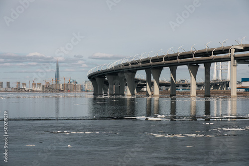 St Petersburg, Russia-April 2022: View of Western high-speed diameter, skyscraper Lakhta center and residential space construction of Sea facade on Vasilievsky island from Kanonersky island photo