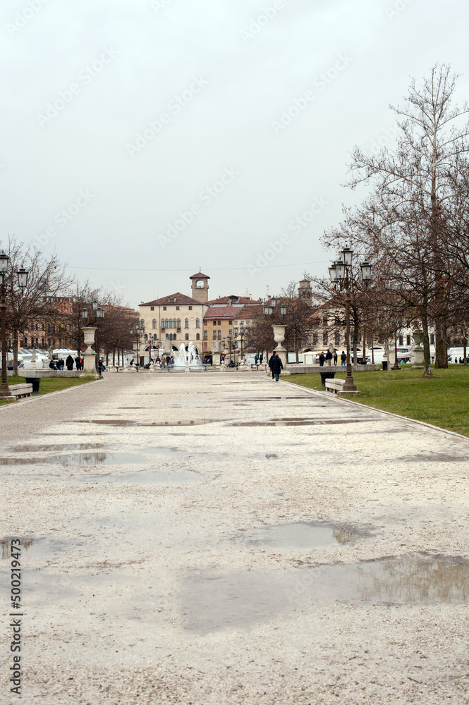 Path inside the park in the great Piazza Prato della Valle during the winter. Padua, Italy.