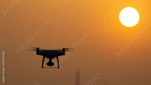 Silhouette shot of a drone at sunrise © mark