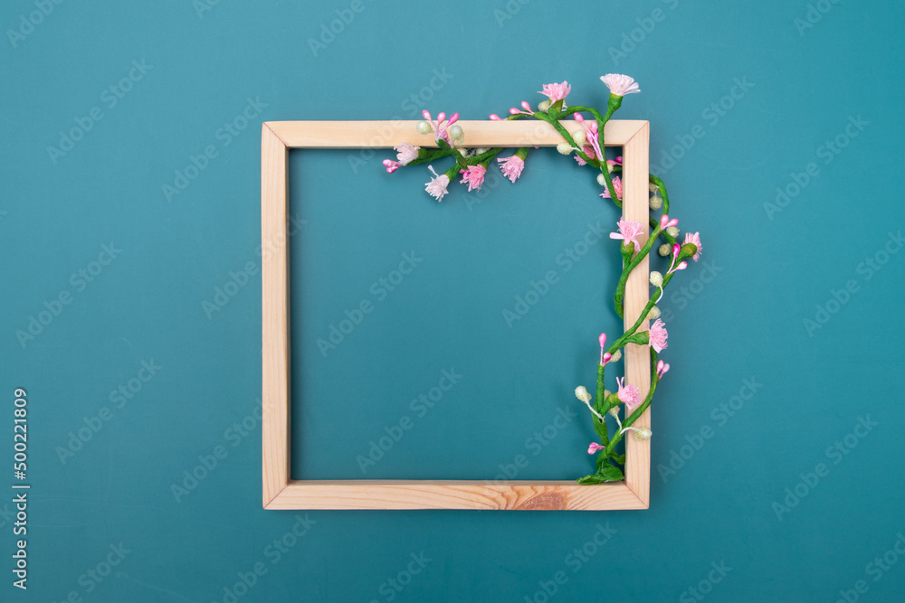 Square wooden frame mock up with decorative floral ornaments with copy space top view Square wooden frame mock up with decorative floral ornaments with copy space top view