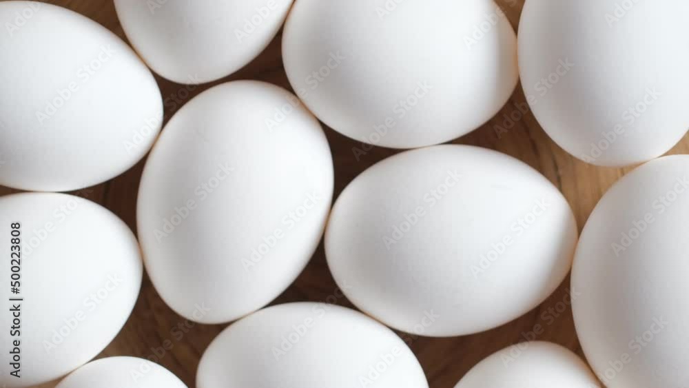 Chicken egg, rotation shot, Chicken fresh raw eggs.Healthy fresh food ingredients for breakfast. Animal products. Grocery. Chicken farm fresh eggs Chicken egg, rotation shot, Chicken fresh raw eggs.Healthy fresh food ingredients for breakfast. Animal products. Grocery. Chicken farm fresh eggs