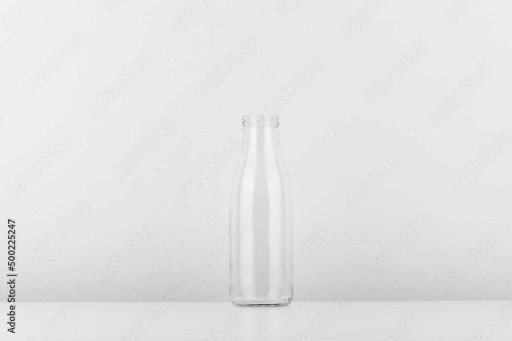 Empty glass bottle without cap. Bottle for milk and water isolated on white background. Empty glass bottle without cap. Bottle for milk and water isolated on white background.