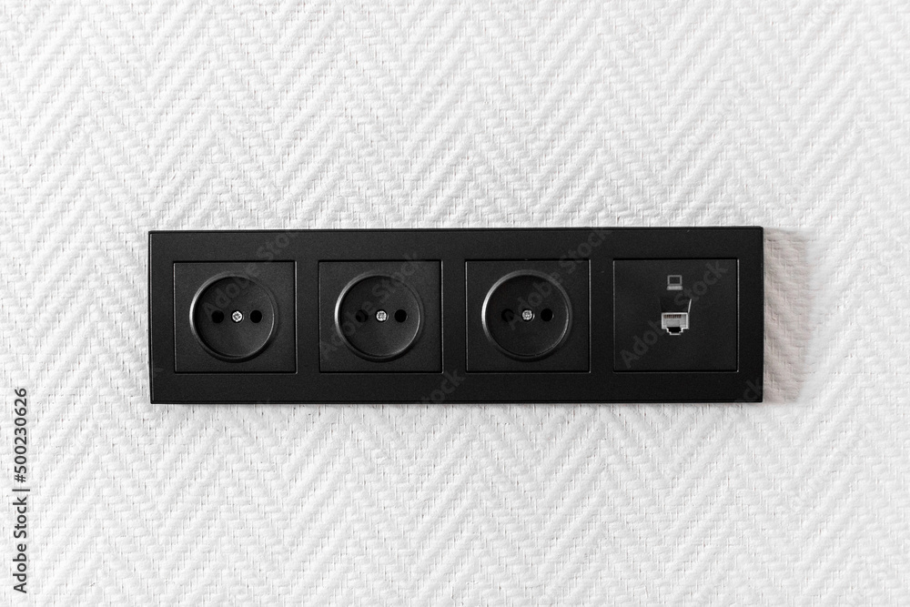 Electrical household switches and sockets close up. Minimalist interior design. Stylish bedroom and living room- Image Electrical household switches and sockets close up. Minimalist interior design. Stylish bedroom and living room- Image