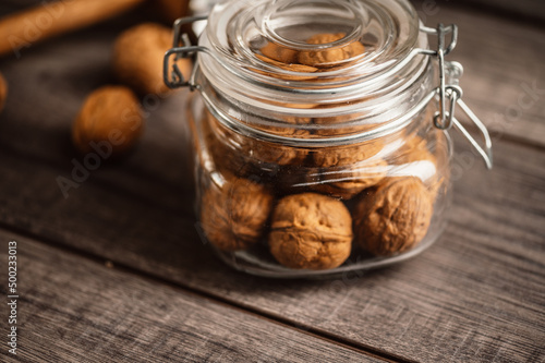 Whole and open walnuts with walnut grain on a wooden table. Fruit healhy oraganic raw snack food. nuts kernels photo