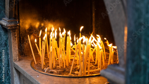 Obraz na plátne Lighted candles outside the church in the center of Kerkira in Greece