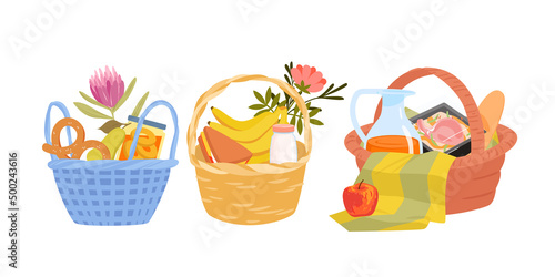 Picnic baskets for family outdoor fun party set vector illustration. Cartoon barbecue meat, sandwich, baguette and bread snacks, organic healthy banana and apple fruit isolated on white. Food concept