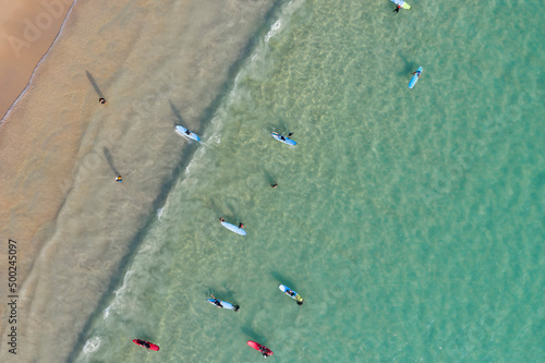 Canvas Print A Lot of People play and surf on Kata beach from Drone top view, a beautiful shot represent the relaxed vacation in Phuket Province, Thailand