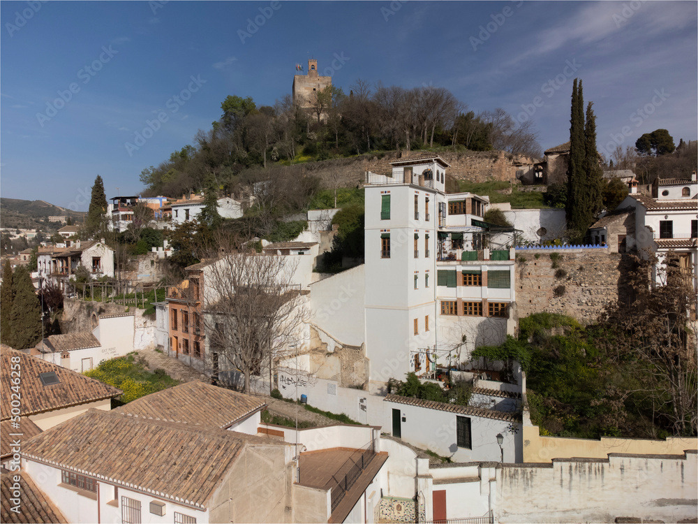 Aerial panoramic view on buildings, old district, mountains and Alhambra palace, world heritage city Granada, Andalusia, Spain
