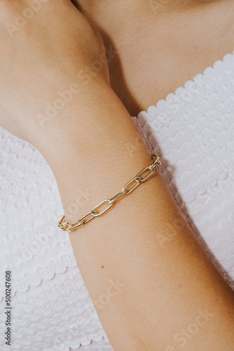 diamond bracelets on the girl's wrist with well-groomed white nail polish. jewelry models for online sale.