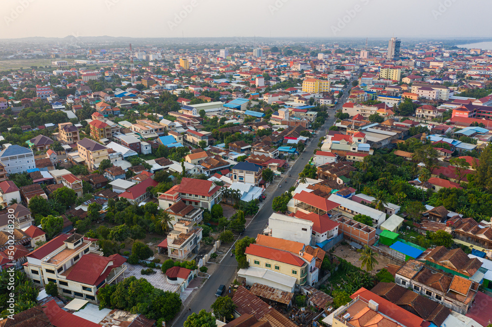 Panoramic drone view of cityscape near Mekong River in Kampong Cham, Cambodia. Panoramic drone view of cityscape near Mekong River in Kampong Cham, Cambodia.