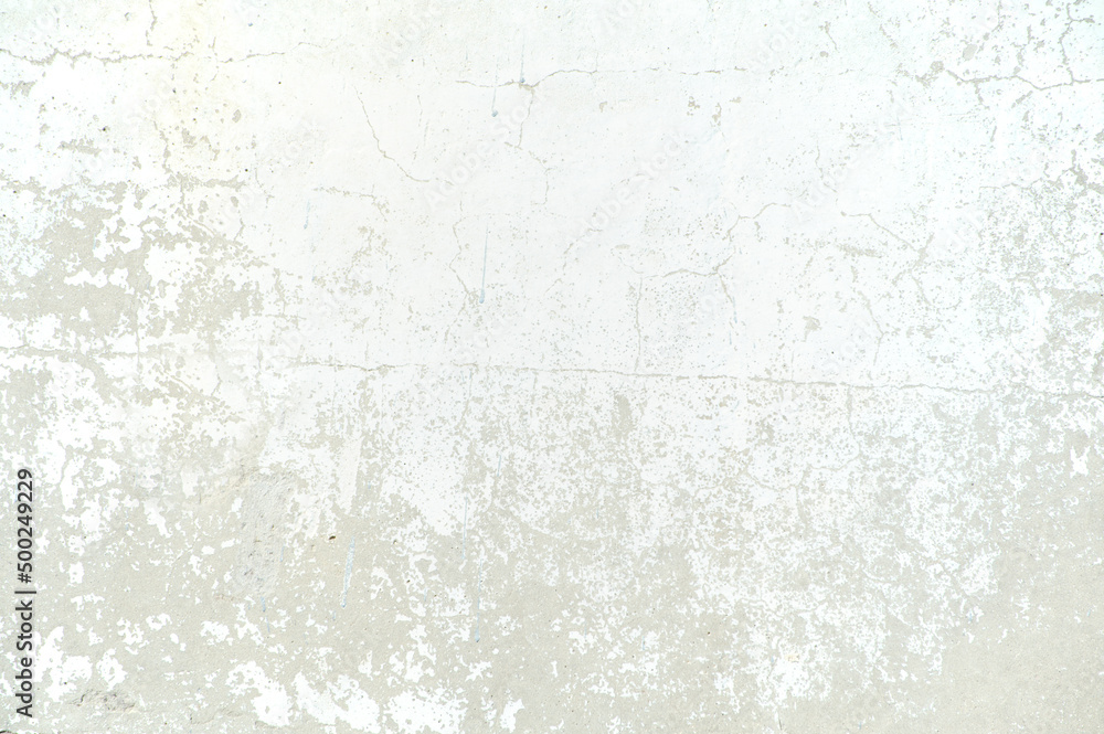 Fototapeta premium Renovation needed wall with falling apart white paint