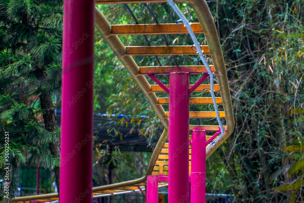 Closeup of roller coaster and tracks in a children's playground Closeup of roller coaster and tracks in a children's playground