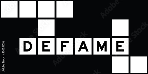 Alphabet letter in word defame on crossword puzzle background