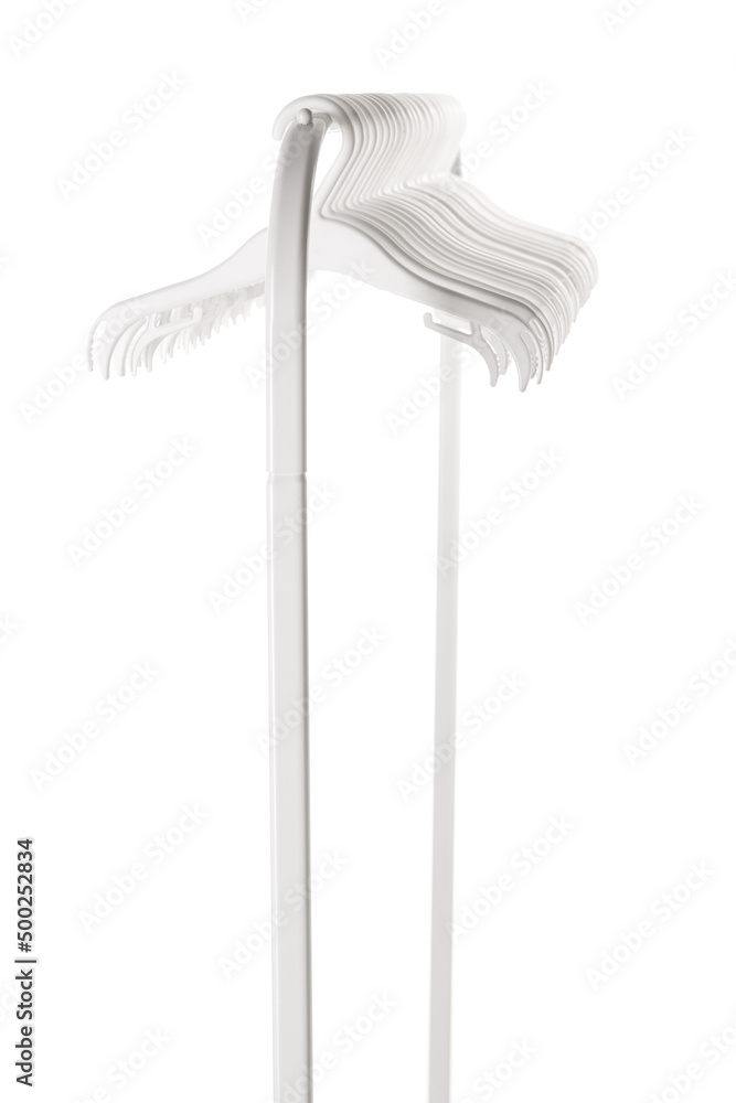 White plastic hangers for clothes hanging on rod from clothing rack. Isolated on white background.. White plastic hangers for clothes hanging on rod from clothing rack. Isolated on white background..