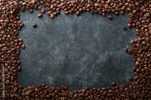 Coffee beans background. Roasted coffee beans. View from above. Coffee concept. Mock up.