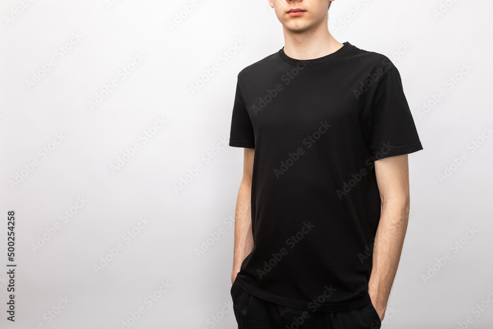 Blank black tshirt on teen studio shot on gray background Blank black tshirt on teen studio shot on gray background
