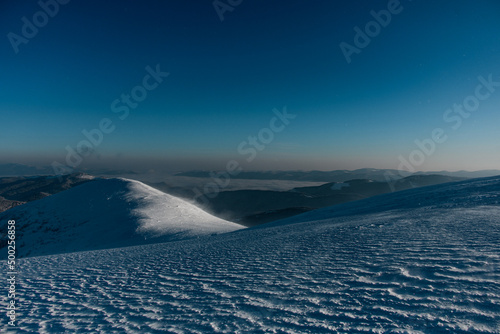 picturesque view of top hills covered with fresh white snow