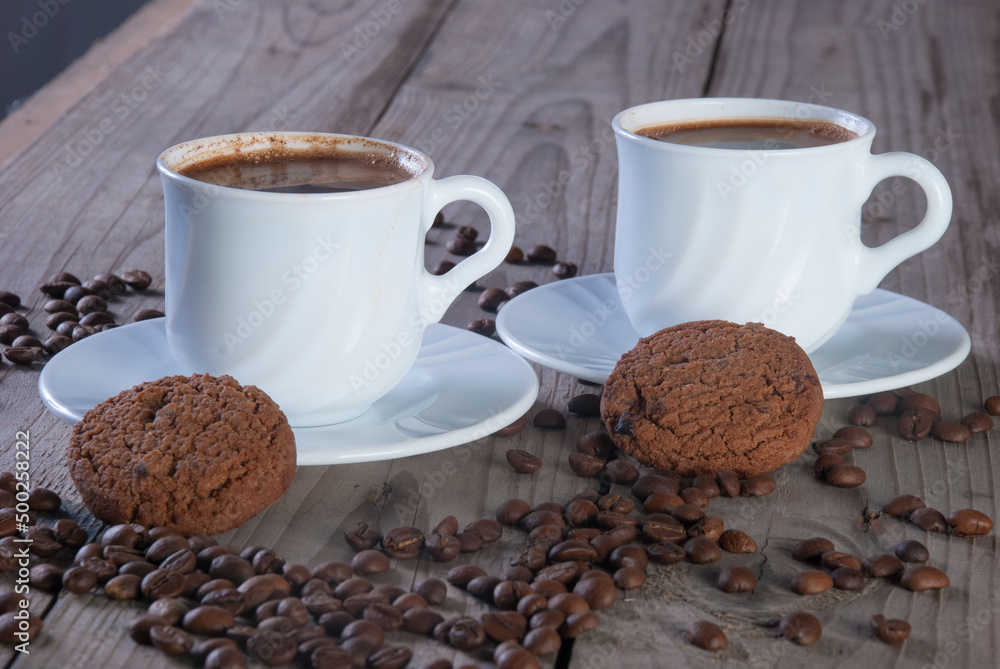 Fresh coffee with biscuits and roasted beans Fresh coffee with biscuits and roasted beans