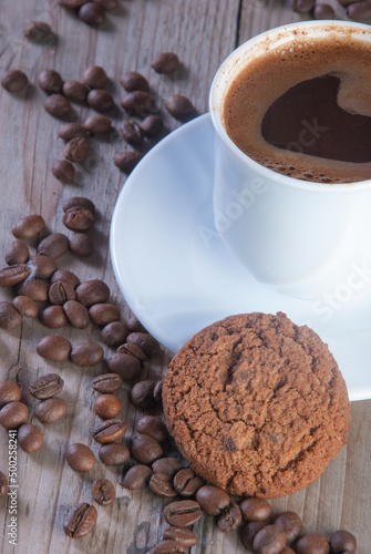 Fresh coffee with biscuits and roasted beans