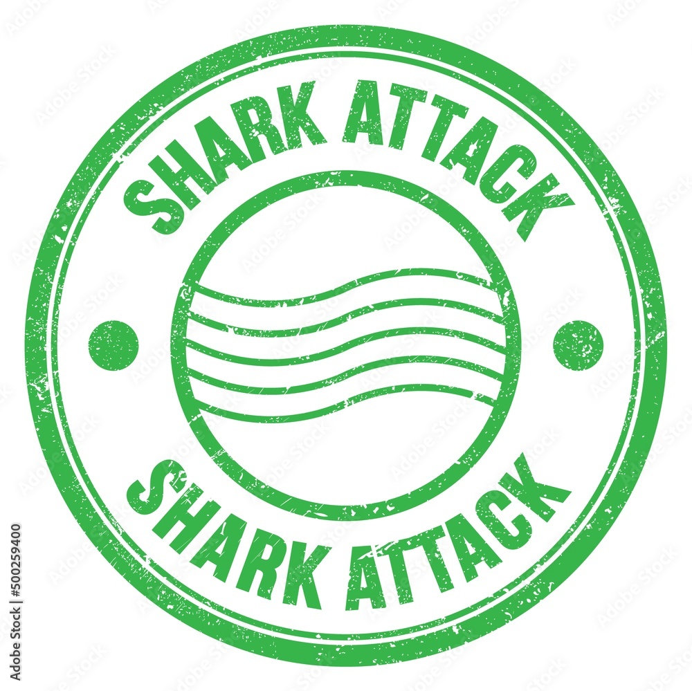 SHARK ATTACK text written on green round postal stamp sign SHARK ATTACK text written on green round postal stamp sign