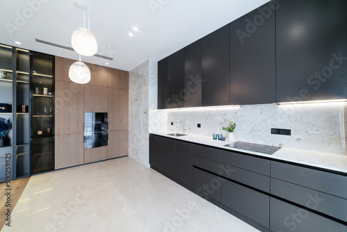 Black  modern  stylish kitchen with lighting