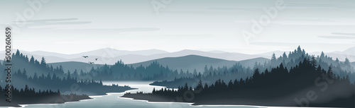 Mountain and lake landscape. Fog covers pine forests and lakes. In the morning or evening.