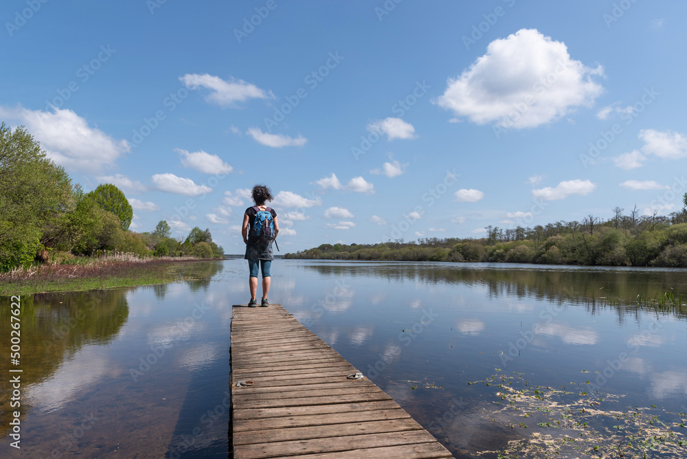 Woman on the jetty. Aureilhan pond. Mimizan. Landes