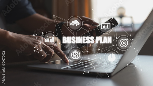 Business plan showing a person working on a laptop is included.
