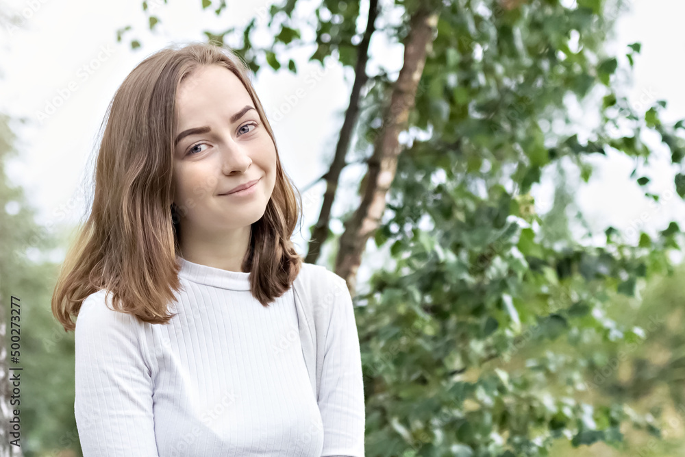 Portrait of a young teenager girl in the park. Spring. Portrait of a young teenager girl in the park. Spring.