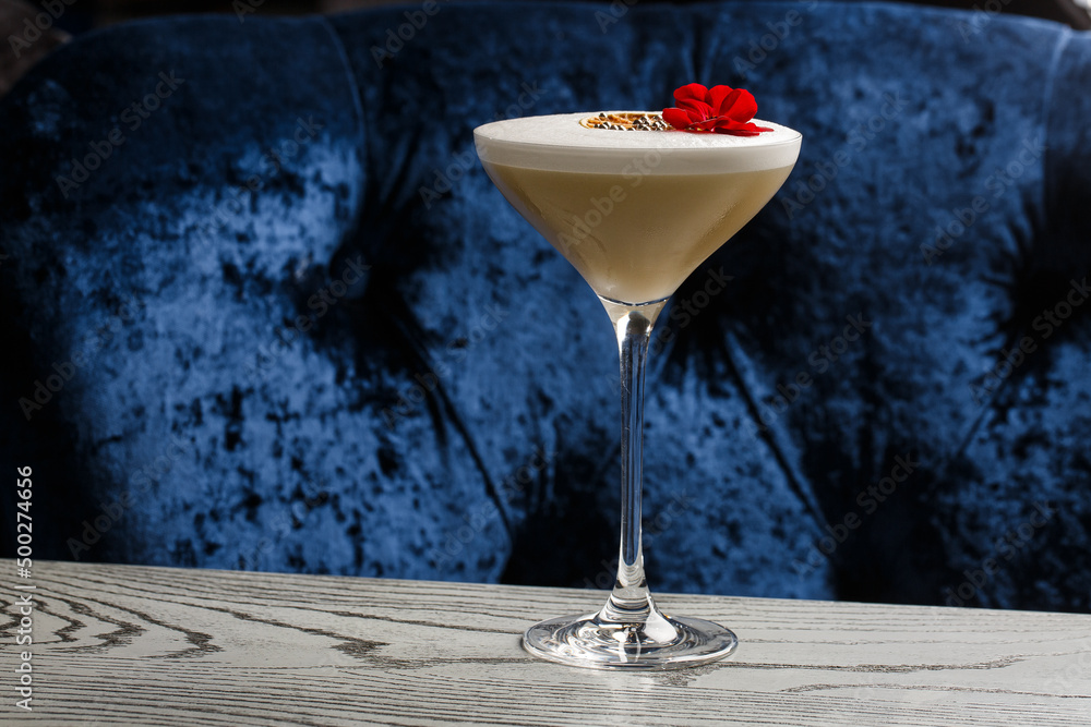 Coffee cocktails and liquor on blue reflective background. Copy space for your text.
