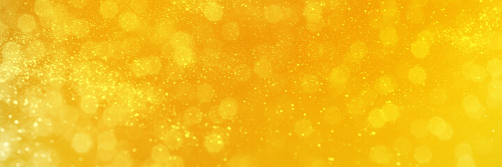Bright yellow sparkling glitter bokeh background, banner texture. Abstract defocused lights header. Wide screen wallpaper. Panoramic web banner with copy space for design