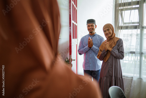 beautiful muslim family visiting at the house on eid mubarak celebration photo