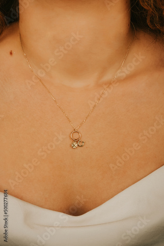 Close up necklace on necklace girl's neck. Beautiful woman wearing black jacket style with diamonds, six, diamond necklace, luxury fashion jewelry.
