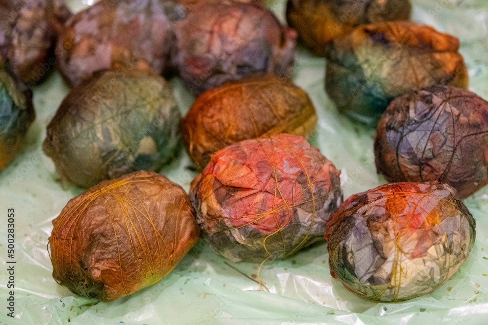 Easter egg dyeing, wrapping in fabric, Latvia Easter egg dyeing, wrapping in fabric, Latvia
