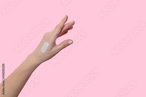 A smear of cosmetic cream on a woman's hand. Moisturizing and skin care.