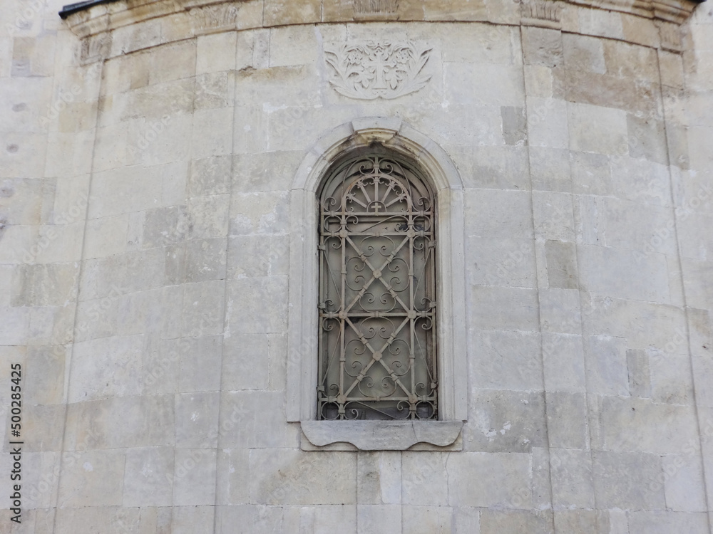 Arch Church Window with a Beautiful Grating