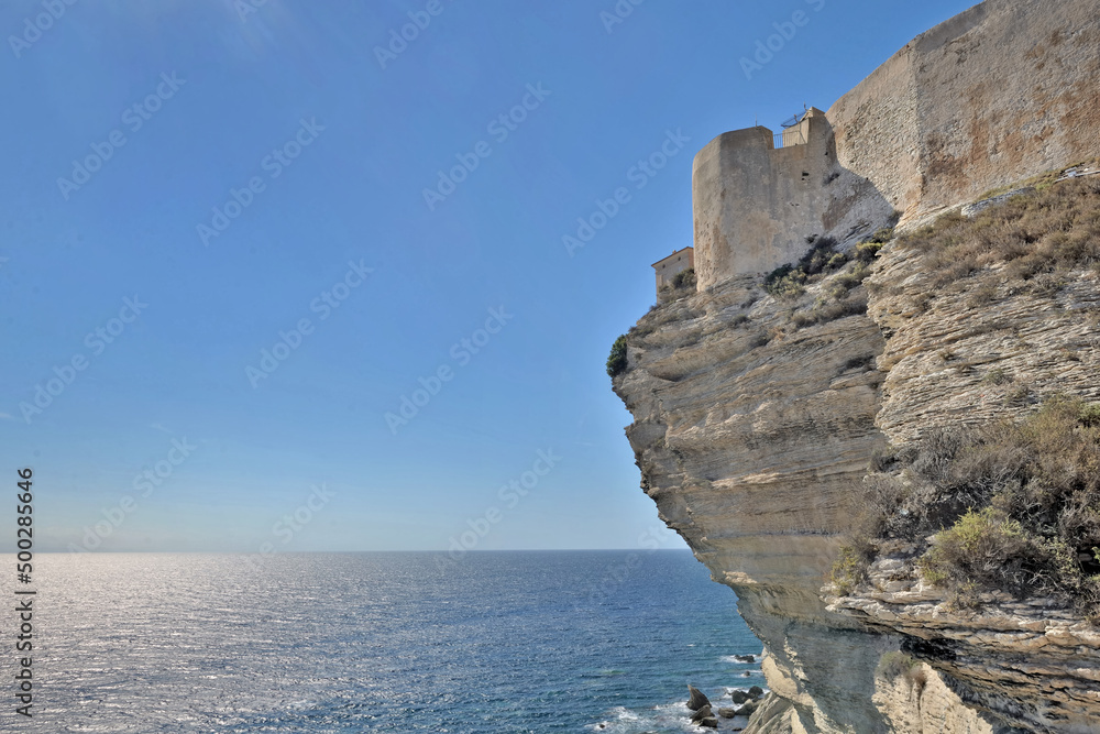 rampart  above limestone cliff of Bonifacio in Corsica overlook the sea on clear blue sky