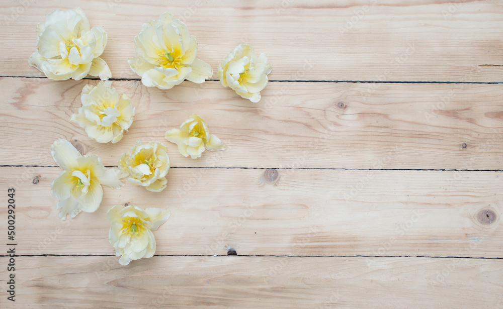bright spring flowers on a wooden background top view. bright spring flowers on a wooden background top view.