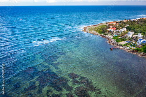 Aerial view of the Akumal Bay in Quintana Roo, Mexico. Caribbean Sea, coral reef, top view. Beautiful tropical paradise beach