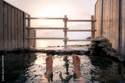 Canvas Print Open air hot spring bath (onsen) overlooking the sunset and pacific ocean at Sawada park open-air bath, Izu, Japan