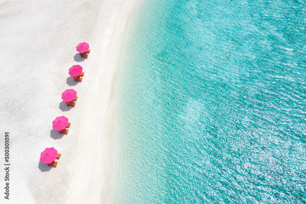 Aerial view, amazing beach with umbrellas and lounge chairs beds close to  turquoise sea. Beautiful view summer beach landscape idyllic relax tranquil  couple vacation, romantic holiday. Freedom travel foto de Stock