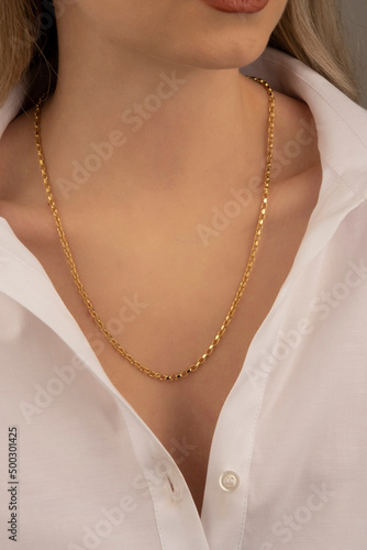 Silver and Gold Jewelry Necklace on Young Woman's Neck