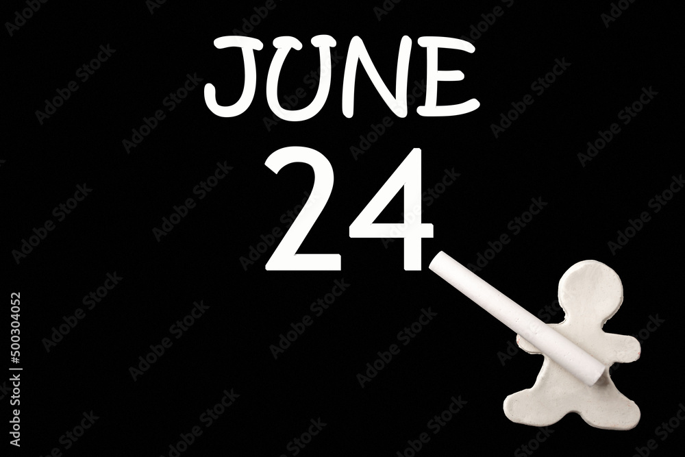 A small white plasticine man writing the date 24 June on a black board. Business concept. Education concept. A small white plasticine man writing the date 24 June on a black board. Business concept. Education concept.