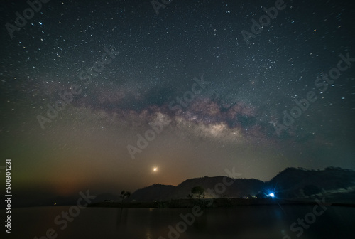 Fototapeta Naklejka Na Ścianę i Meble -  Astro photography and Nightscape photography, Milky way over the boats at Mandan lake, Rajpipla, Gujarat
