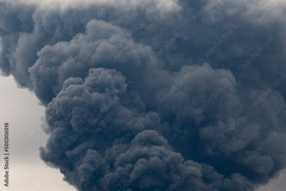 Thick black smoke covers the sky during the war between Ukraine and Russia Thick black smoke covers the sky during the war between Ukraine and Russia
